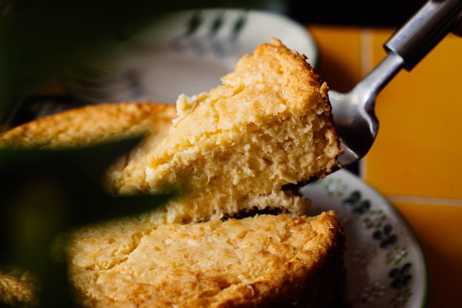 Close-up of a tasty homemade pineapple cake being served, perfect for desserts and gatherings.