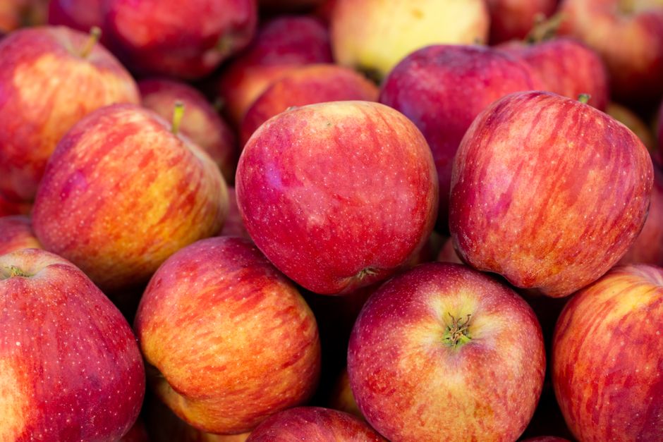 A vivid close-up of fresh red apples, showcasing their ripe and nutritious appeal.