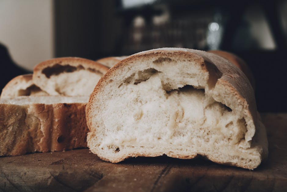Close-up of sliced rustic bread showcasing texture and golden crust.