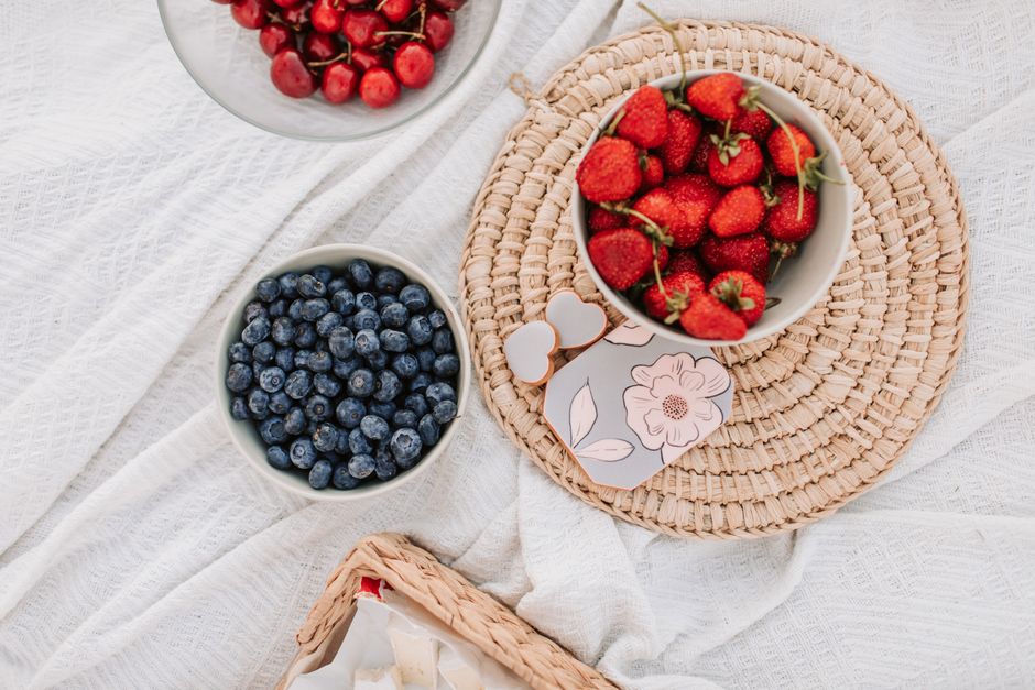 Bowls of fresh summer berries for topping a pavlova