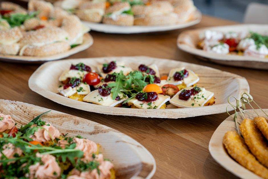 A variety of fresh appetizers on a wooden table, perfect for parties and gatherings.