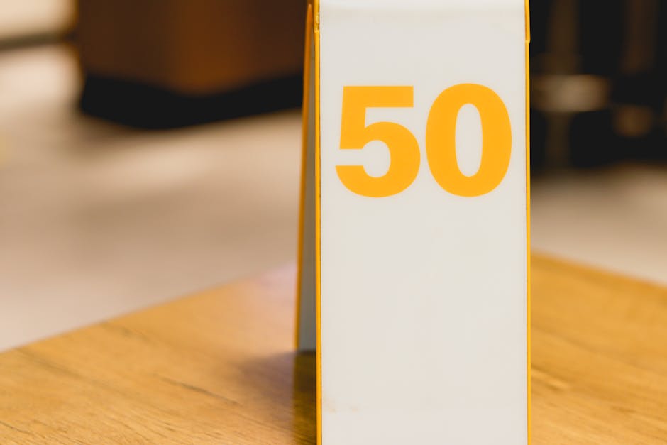Close-up of table number 50 in a modern cafe setting, ideal for restaurant themes.