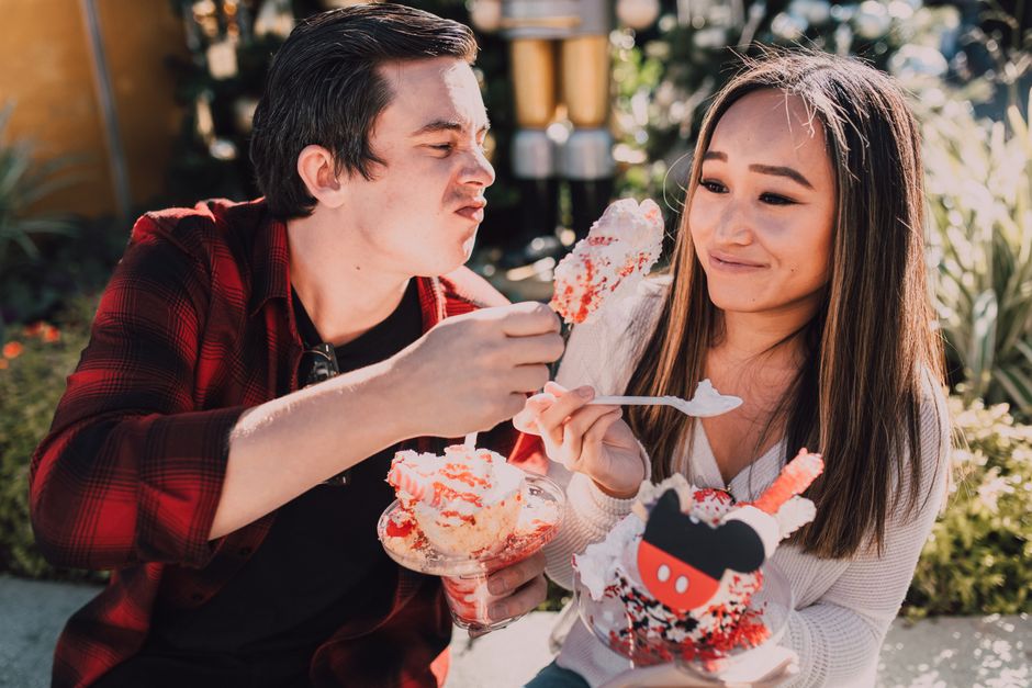 Couple sharing desserts outdoors